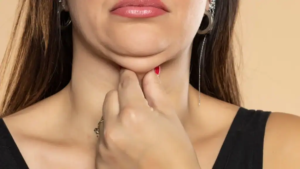 An image of a woman with double chin, sad, worried : Non Surgical Double Chin Removal Treatment in York, UK