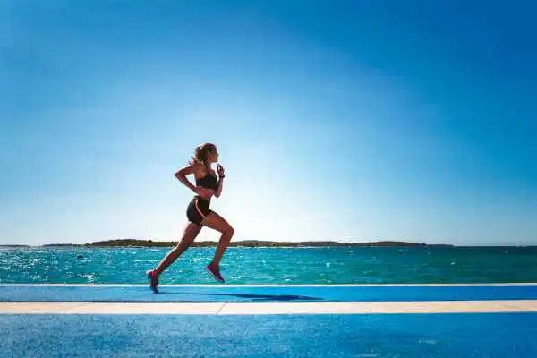 Woman running showing strong leg muscle York